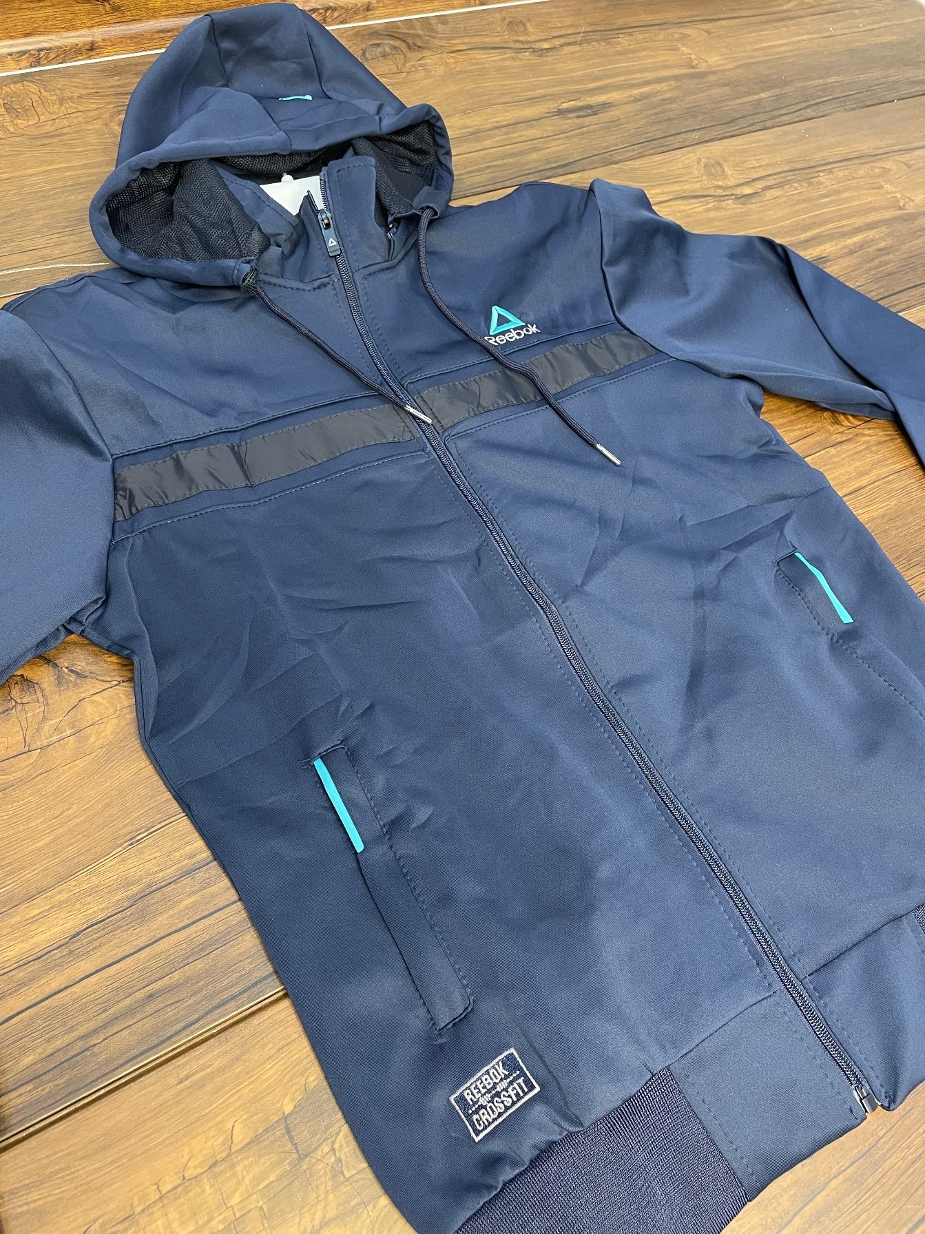 ست لباس ورزشی مردانه ریباک مدل استرج اعلا رنگ سیاه و سرمه ای