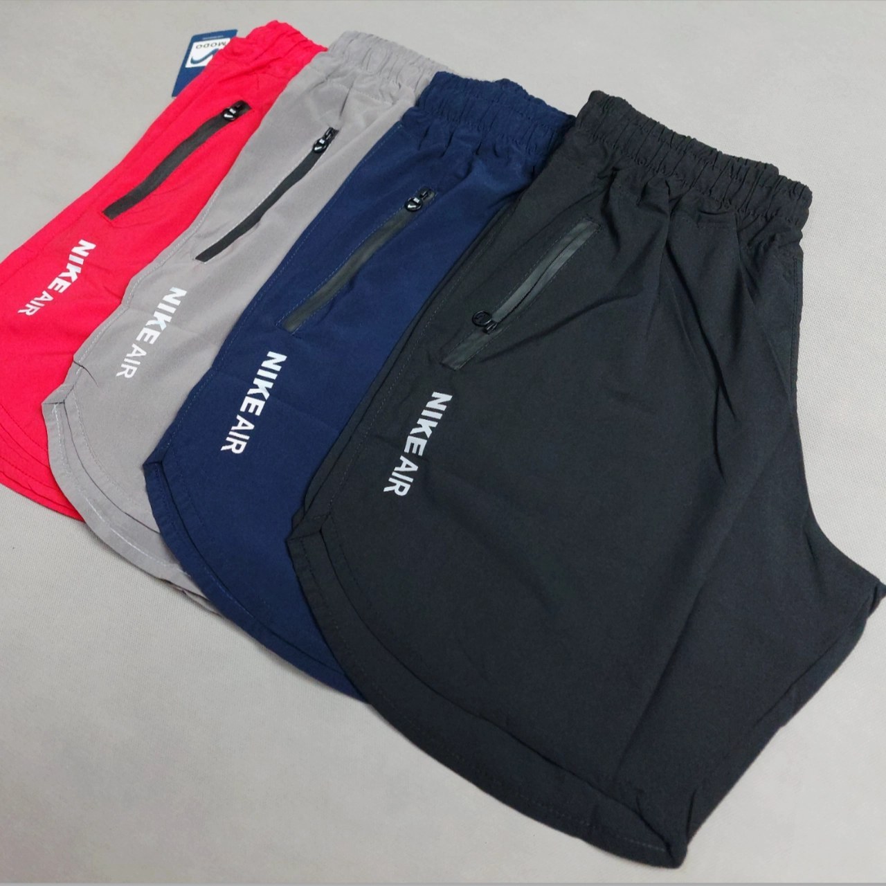 شلوارک ورزشی مردانه نایکی پارچه آیرو رنگ مشکی و سبز